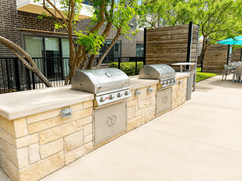 Outdoor kitchen with gas grills